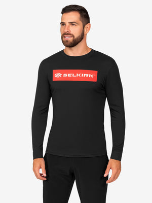 Male model wearing black long-sleeve shirt with red SELKIRK logo across chest