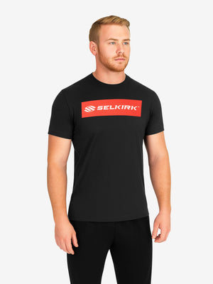 Male model wearing black T-shirt with red rectangular SELKIRK logo on the chest