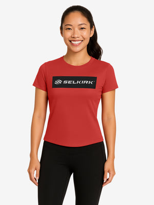 Red short-sleeve tee with black rectangular chest patch reading SELKIRK