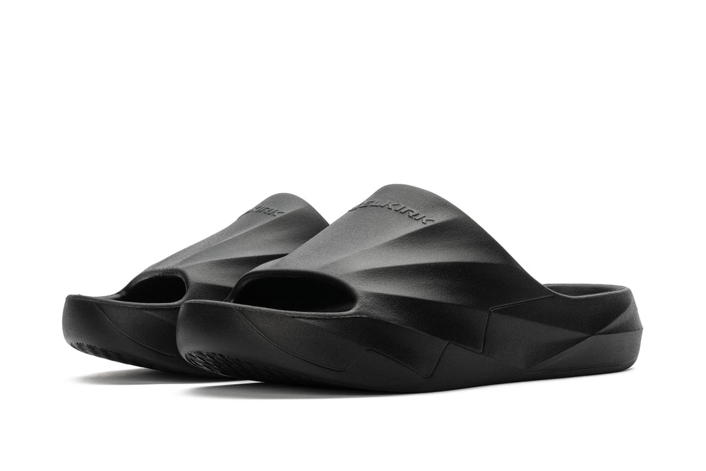 Podium Pickleball Slide in Blackout color, showing open-toe design and EVA foam material.