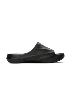 Black molded recovery slide with sculpted geometric upper and contoured footbed