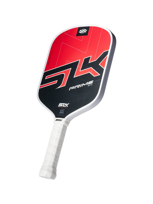 Red and black SLK PRIME pickleball paddle with white grip, large SLK logo and PRIME text on the face.