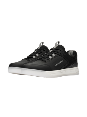 Three-quarter view of Selkirk Legacy Pro pickleball shoes with InfiniGrip, black uppers, white soles, and Selkirk branding
